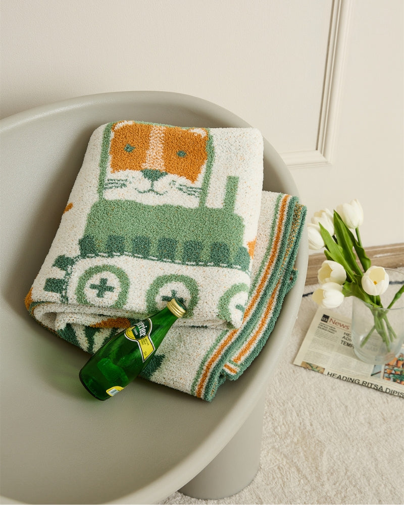 Grand plaid en fausse fourrure vert avec motif de chat