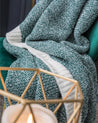 Plaid en matière fausse fourrure de couleur vert