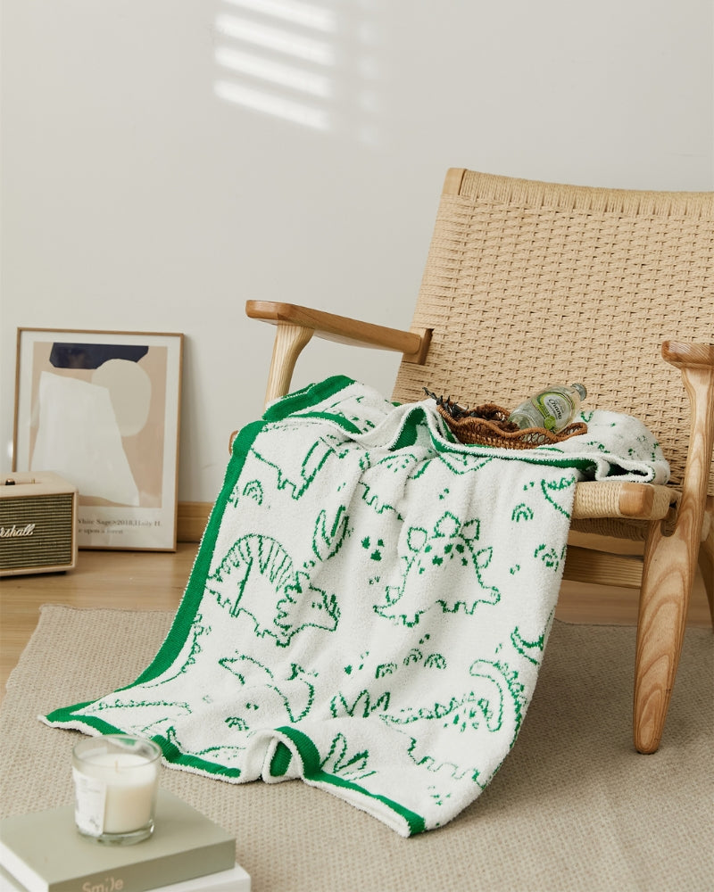 Plaid en matière polaire de couleur blanc et vert avec motifs